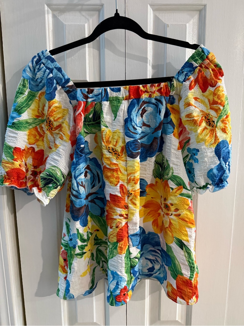 Mlle Gabrielle White Off-Shoulder Floral Top with Blue, Yellow & Orange Blooms